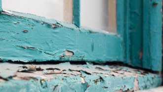 Peeling paint on a window and its sill. Old, peeling paint is a major source of the lead that children can encounter.