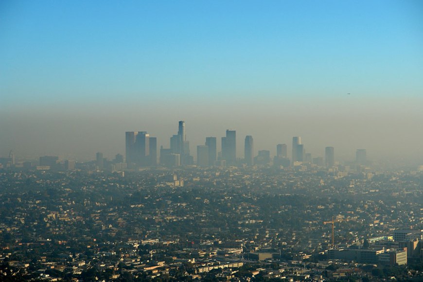 a thick brown haze of smog hangs over the LA skyline