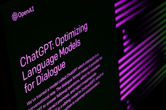 a side view of purple text on a black screen reading 'ChatGPT: Optimizing Language Models for Dialogue'