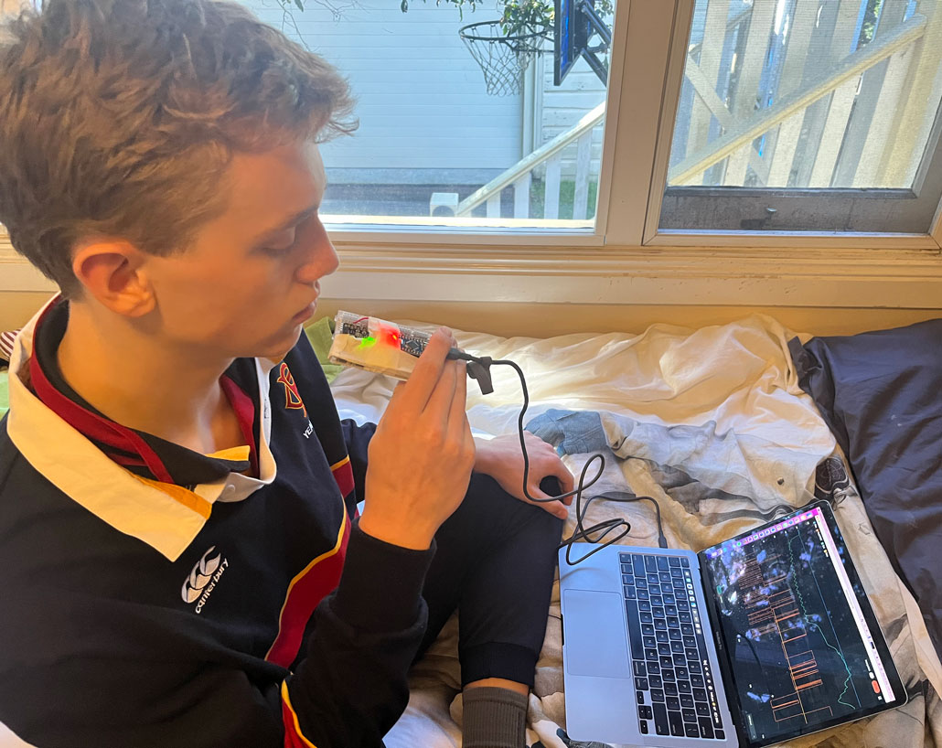 a photo of Tim Wilson breathing into a carbon dioxide sensor