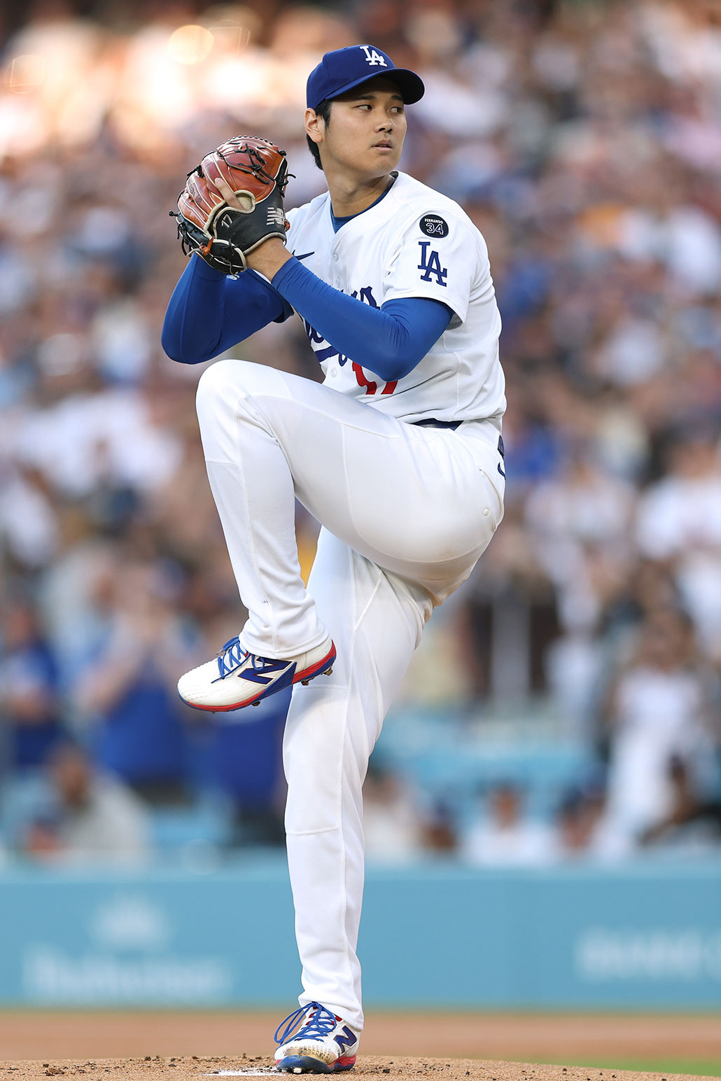 Los Angeles Dodgers baseball pitcher Shohei Ohtani winds up to throw a pitch at Dodger Stadium 