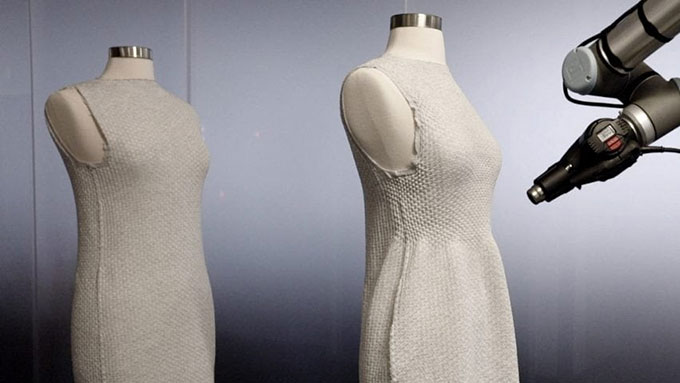two 3D printed dresses on dress forms, one has been heat treated with a heat gun to change the shape