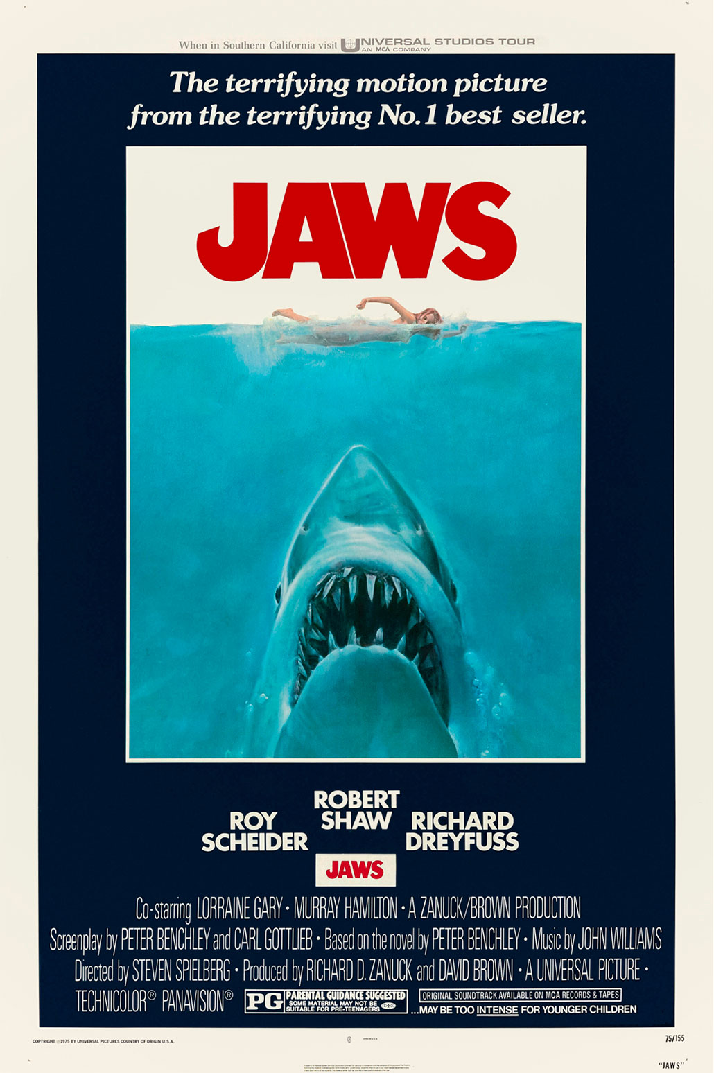 The move poster for 'Jaws' with a large shark swimming up through the ocean directly under a swimming person