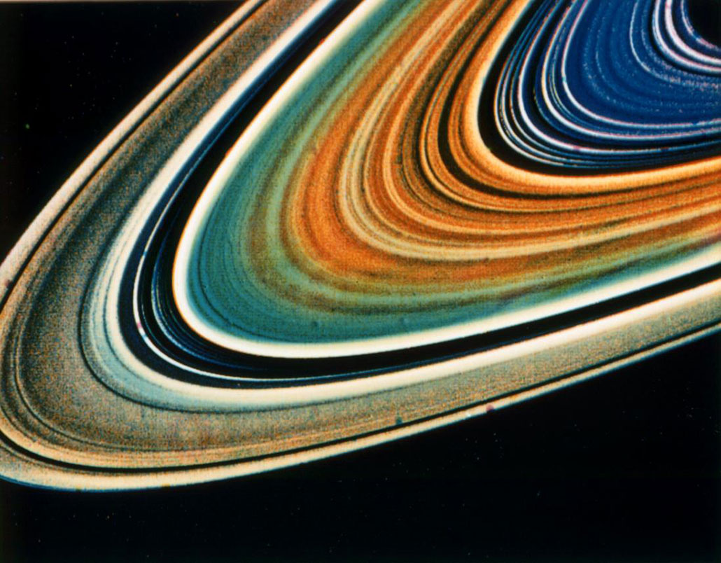 a colorful photo of Saturn's rings as recorded by Voyager