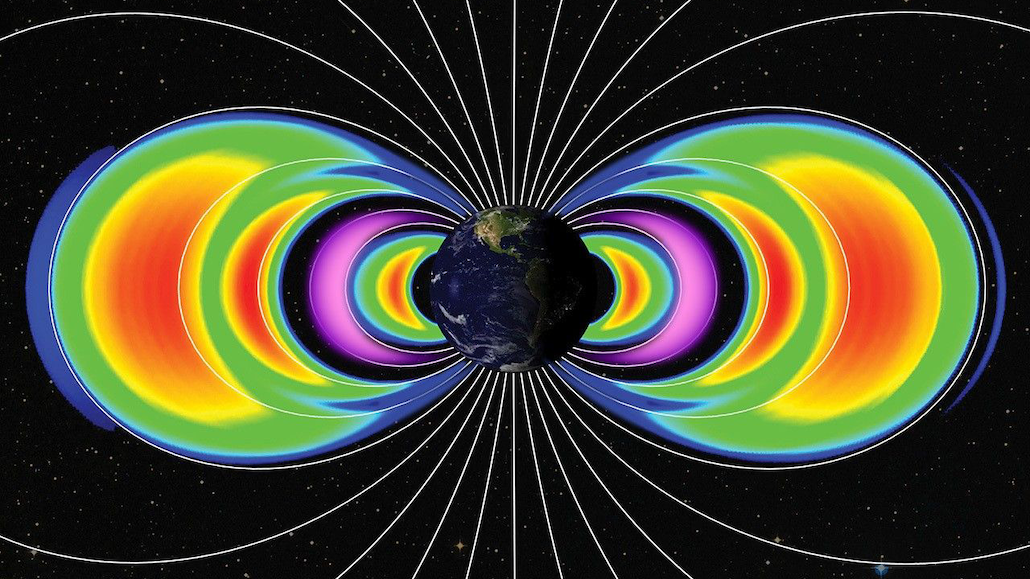 a set of crescent-shaped rings of different colors encircle earth